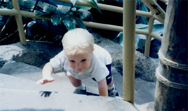 Alex goes up the steps at the Aquarium of the Americas