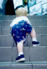 Alex goes up more steps at the Aquarium of the Americas
